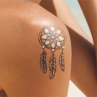 Dream catcher tattoo on shoulder